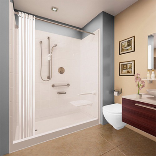 Bathroom scene featuring tiled accessible shower with grab bars handheld shower head and wall mounted folding seat